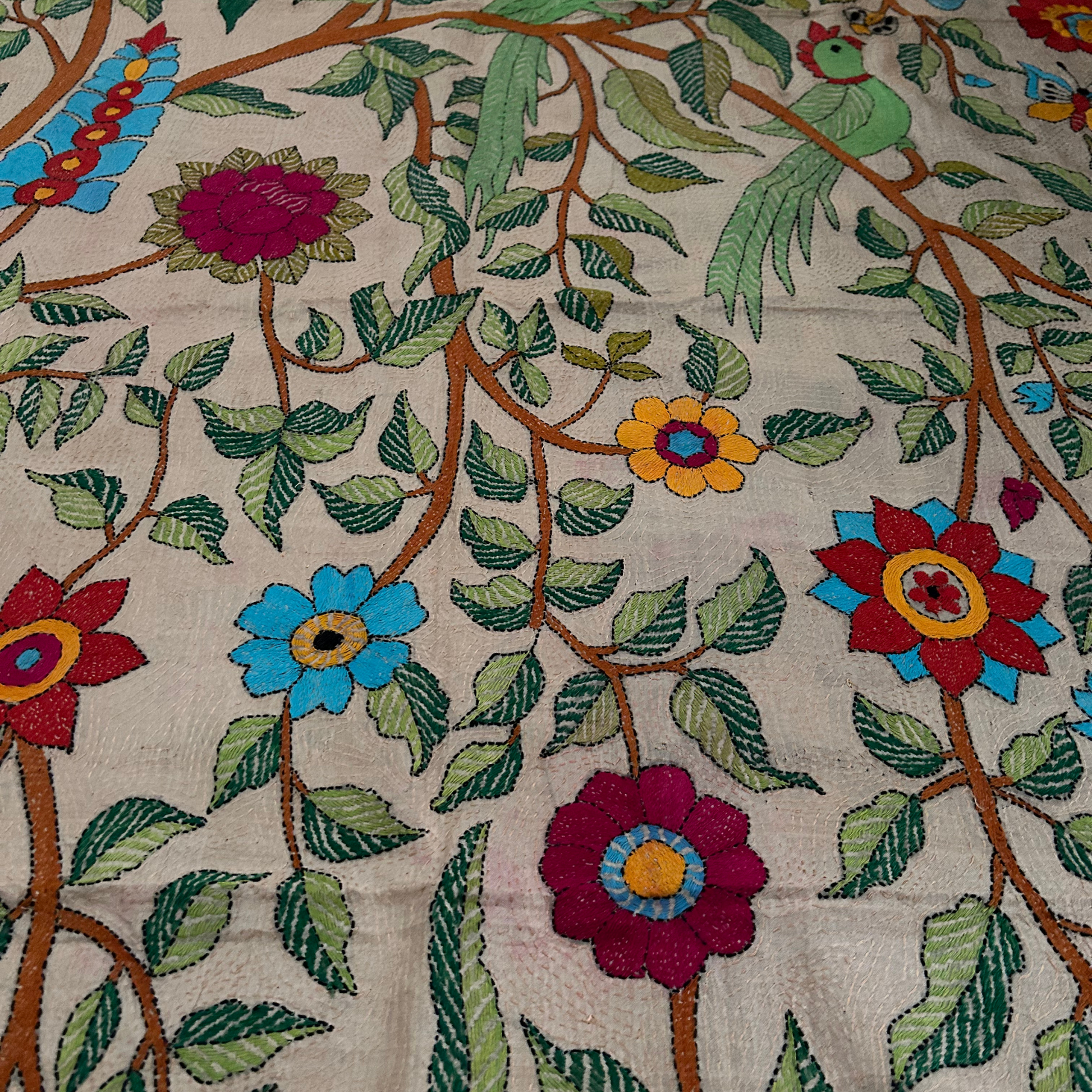 Vibrant and colorful Nakshi Kantha Tussar silk tapestry with forest design.