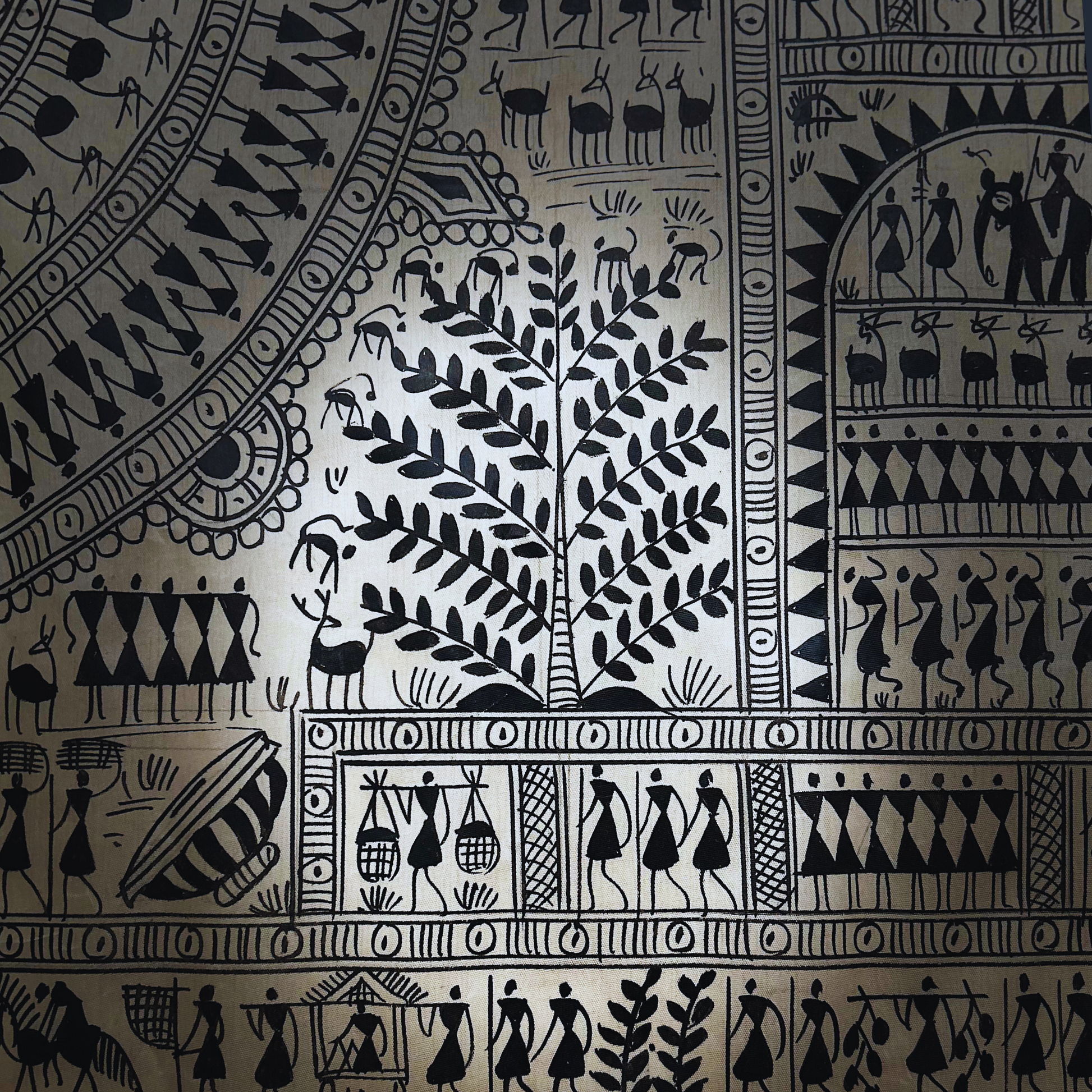 Handcrafted black and white Pattachitra wall hanging with Warli art.