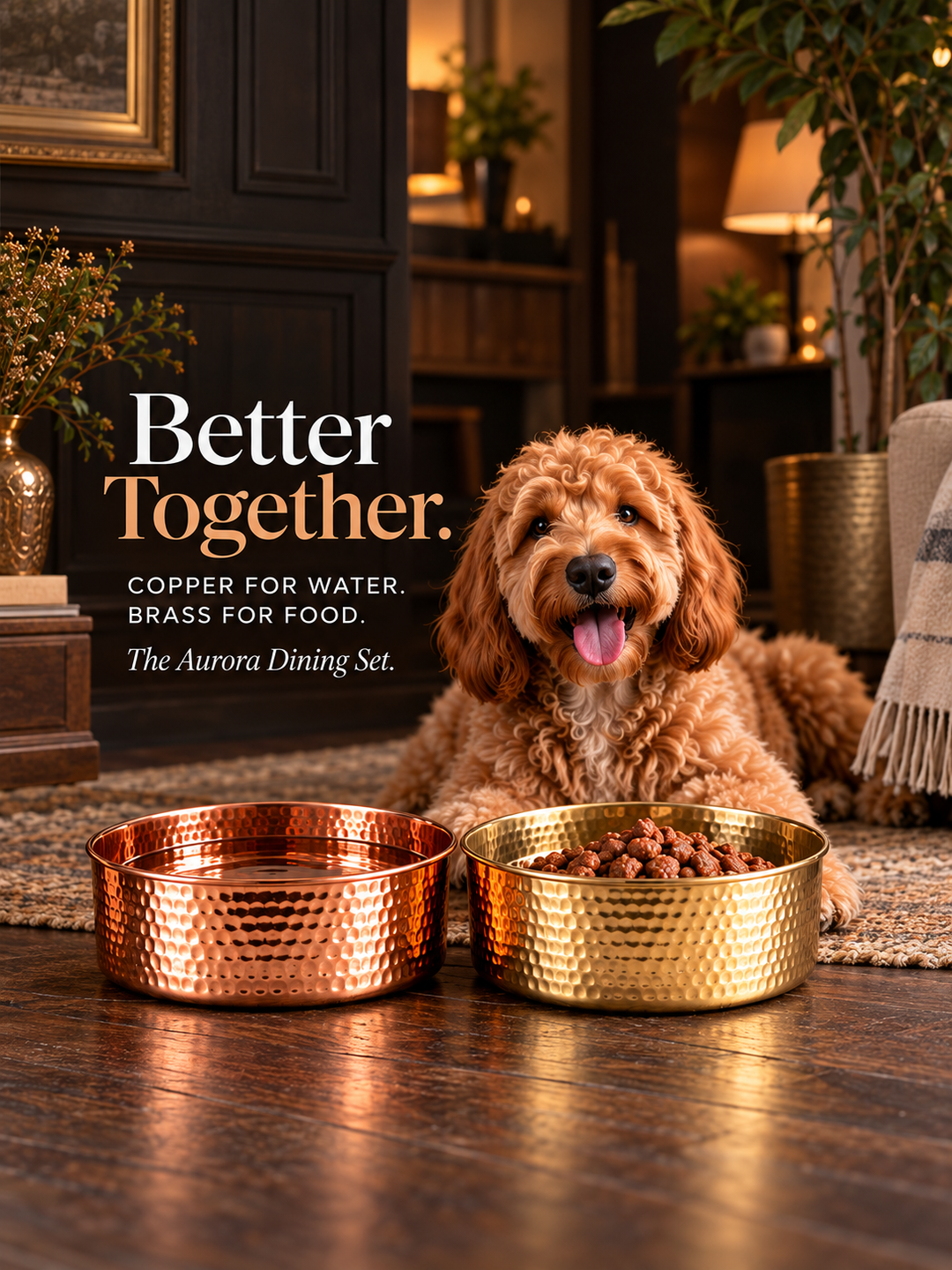Goldendoodle lying beside the AURORA hand-hammered copper pet water bowl and hammered brass pet food bowl, Better Together Dining Set