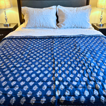 Block printed Jaipuri reversible cotton quilt in deep blue.