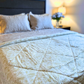 Versatile Jaipuri reversible quilt for all-season use.