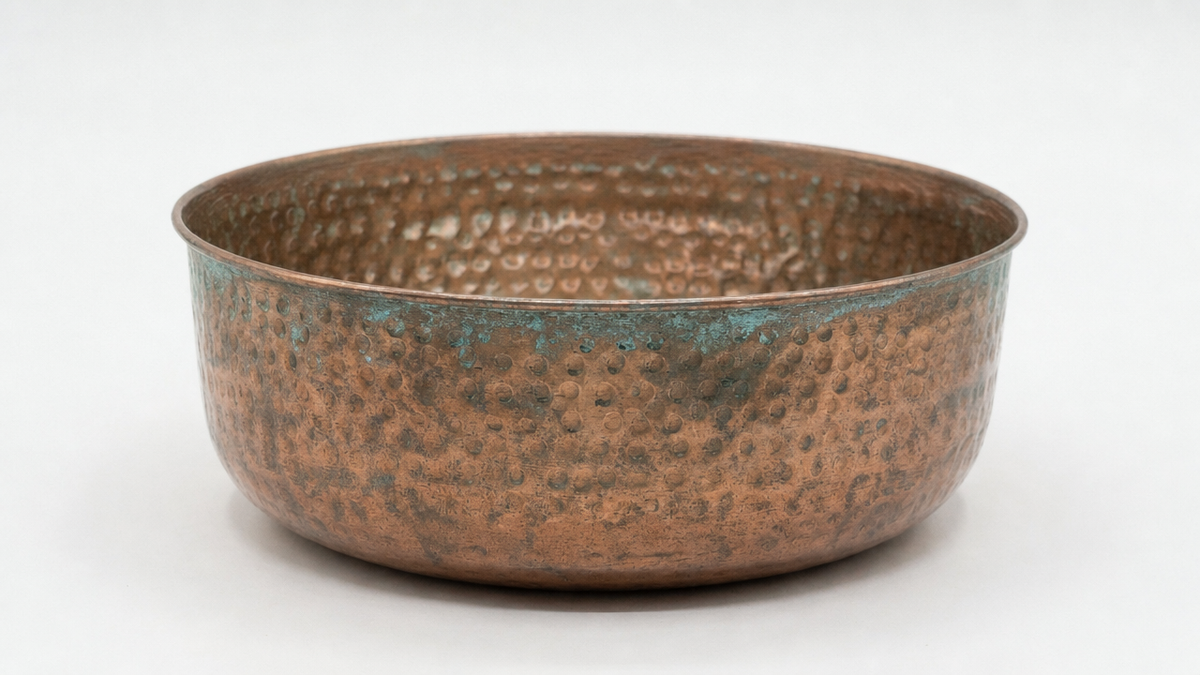 Tarnished, oxidized pure copper pet bowl before cleaning with Perfect Polish