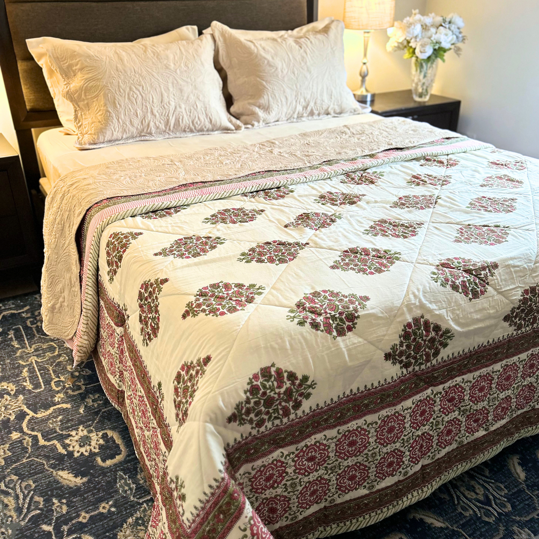 Decorative cotton Kantha throw quilt, handmade with intricate patterns.