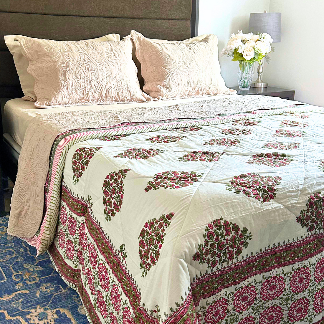 Decorative cotton Kantha throw quilt, handmade with intricate patterns.