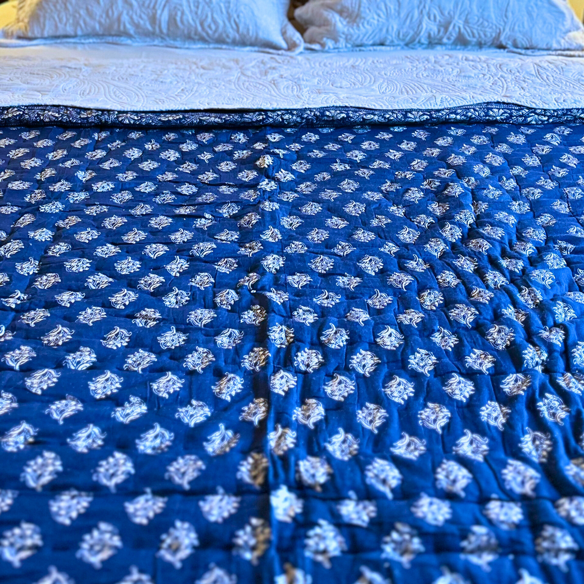 Jaipuri cotton quilt, block printed in deep blue.