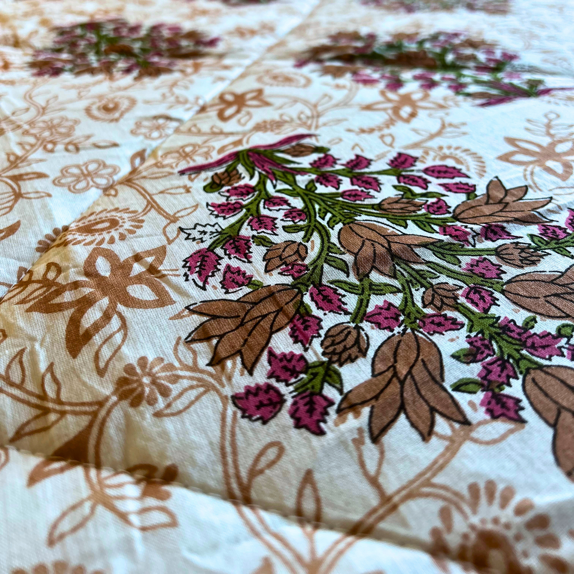 Soft and lightweight floral design cotton quilt.