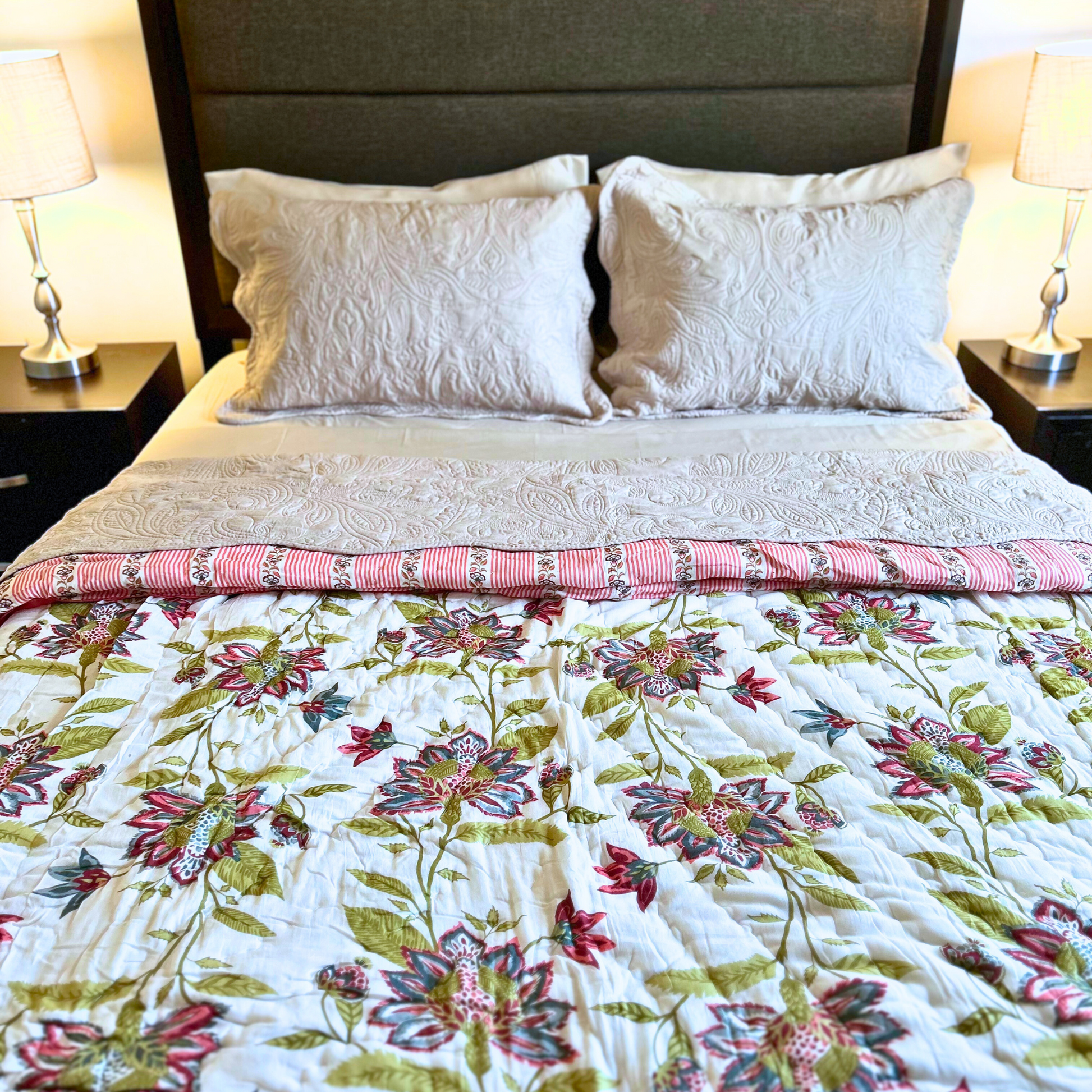 Floral Jaipuri cotton quilt, reversible in green and red.