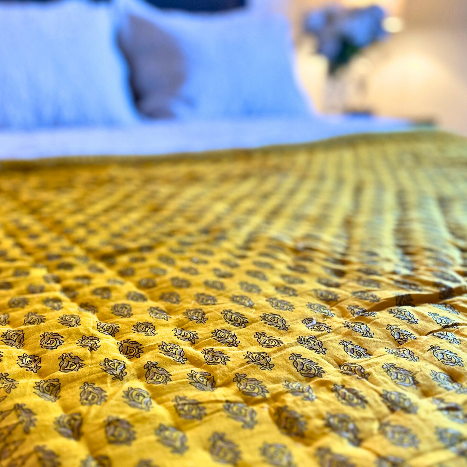 Elegant floral print Jaipuri quilt in sunny yellow.