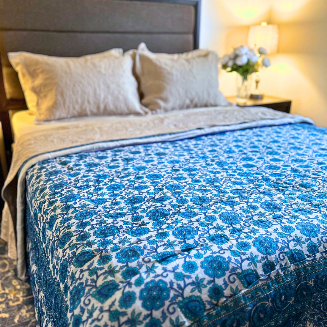 Handcrafted Jaipuri reversible cotton quilt for all-season comfort.