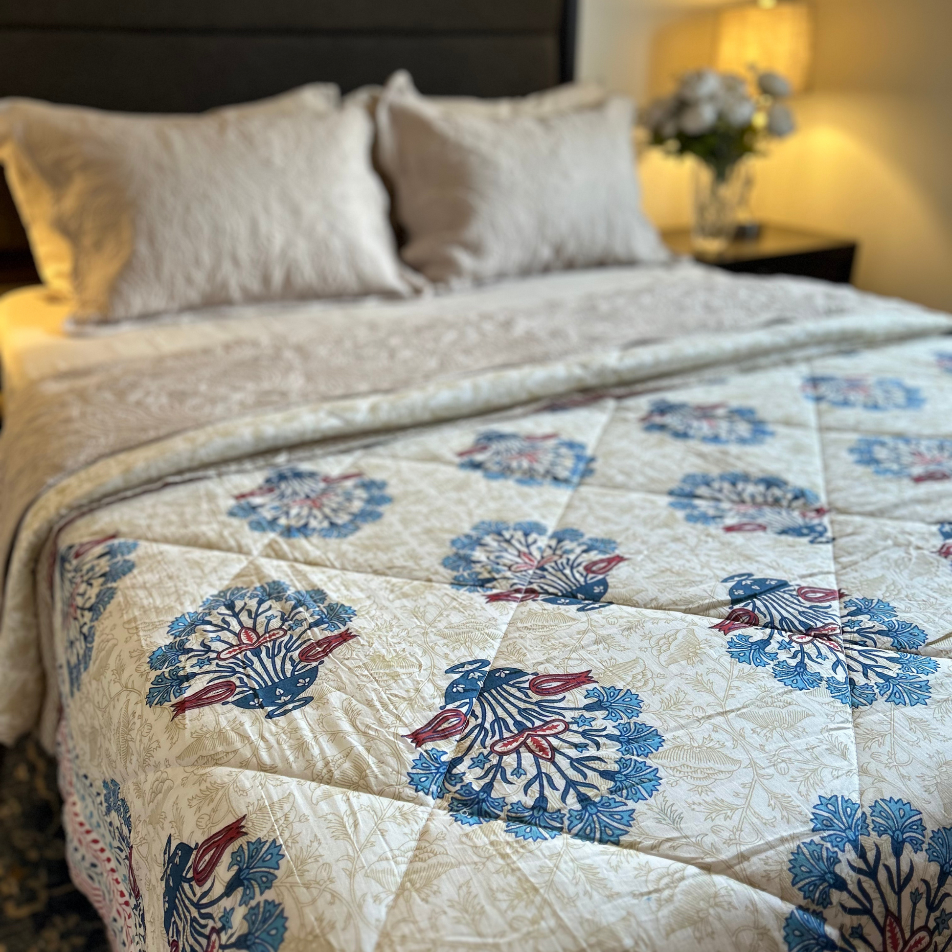 Handcrafted Jaipuri reversible cotton quilt with intricate design.