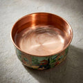 Close-up of PALACE copper pet bowl filled with water, showing pure copper interior