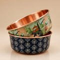 PALACE and DAMASK copper pet bowls side by side, showing both exclusive patterns