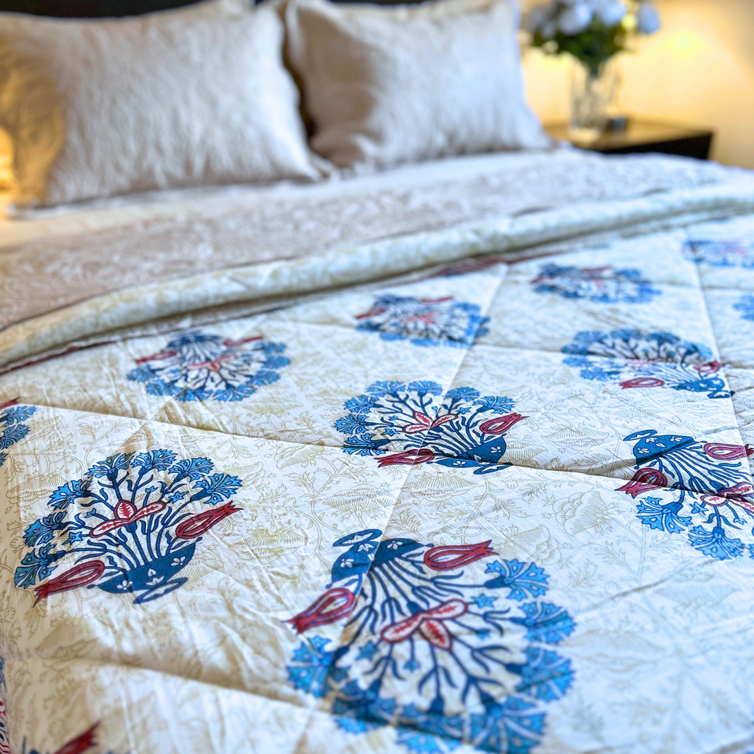 Handcrafted Jaipuri reversible cotton quilt with intricate design.