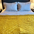 Jaipuri floral print reversible quilt featuring vibrant yellow.