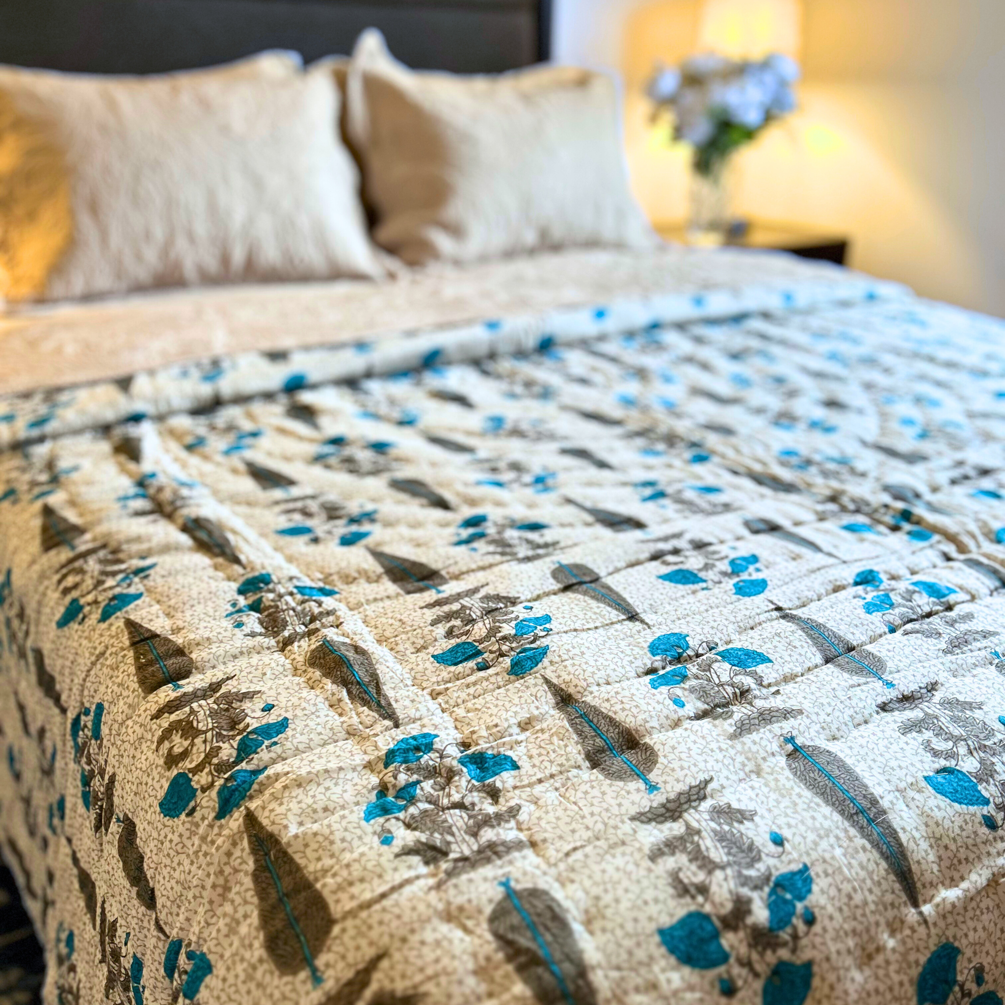 Lightweight Jaipuri block print reversible quilt in blue and gray.