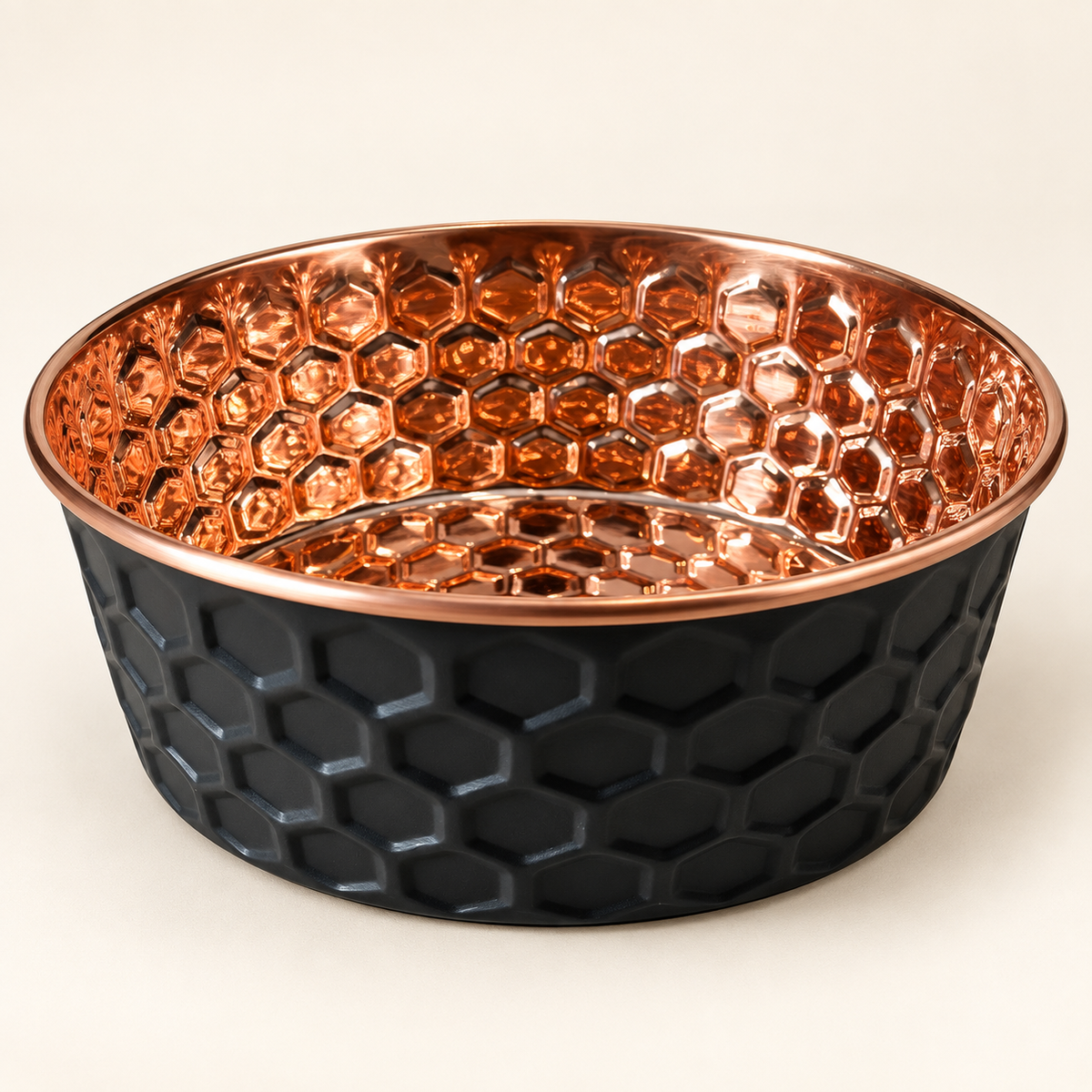ONYX black diamond-hammered copper pet bowl with polished copper interior, studio shot on a cream background