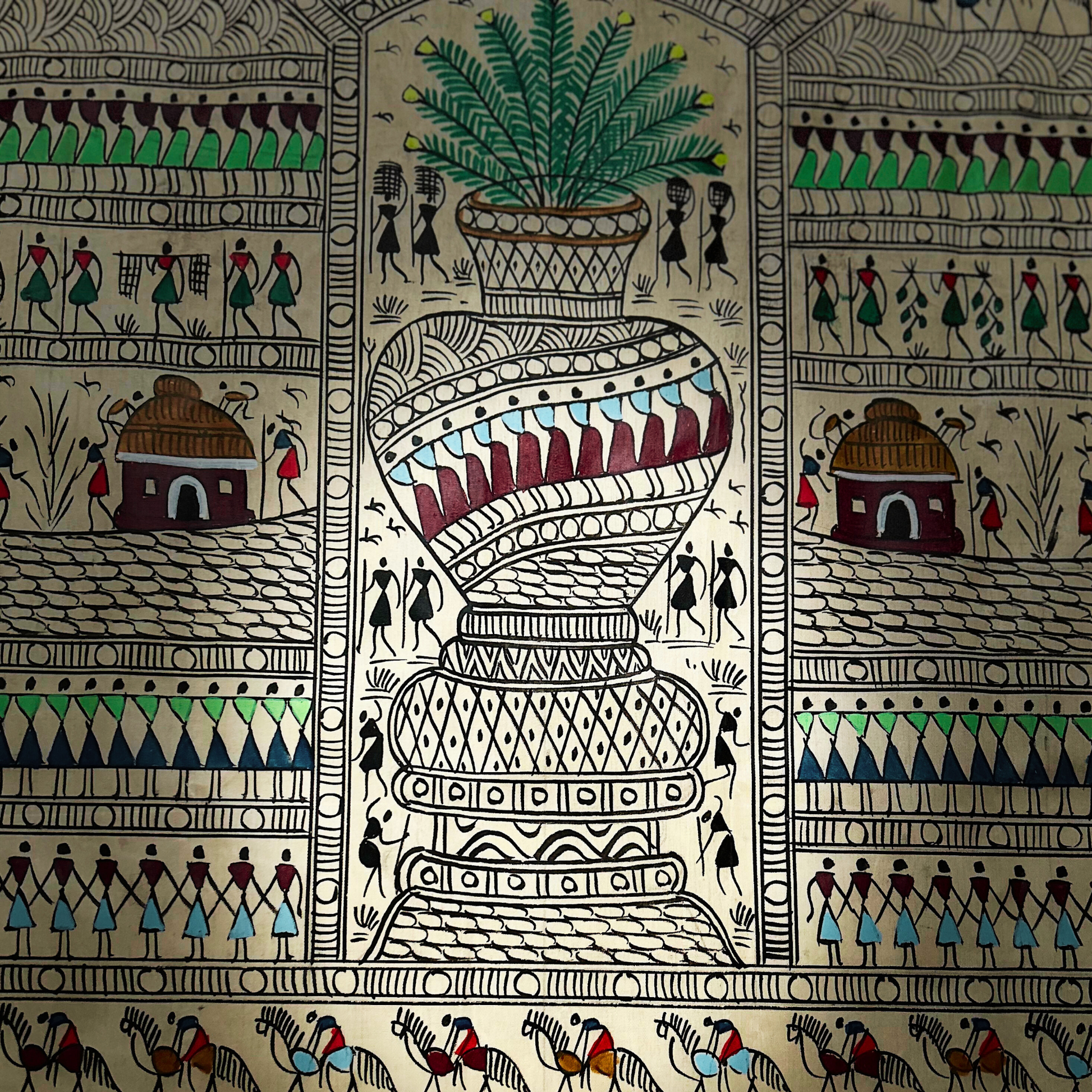 Handcrafted colorful Pattachitra wall hanging with Warli art.