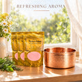 Perfect Polish 3-pack copper and brass cleaner with a refreshing aroma next to a polished copper bowl