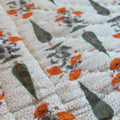 Vibrant orange-green cotton quilt Jaipuri reversible.