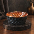 Video of water being poured into an ONYX black honeycomb-hammered 99.9% pure copper dog and cat water bowl with a polished copper interior