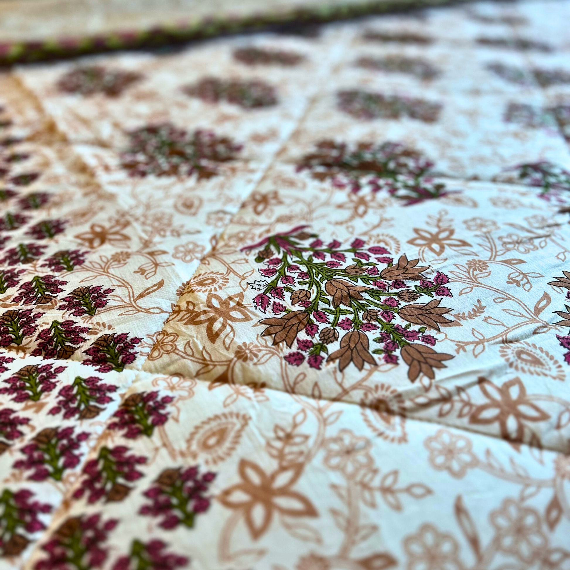 Stylish Jaipuri reversible quilt featuring floral motifs.