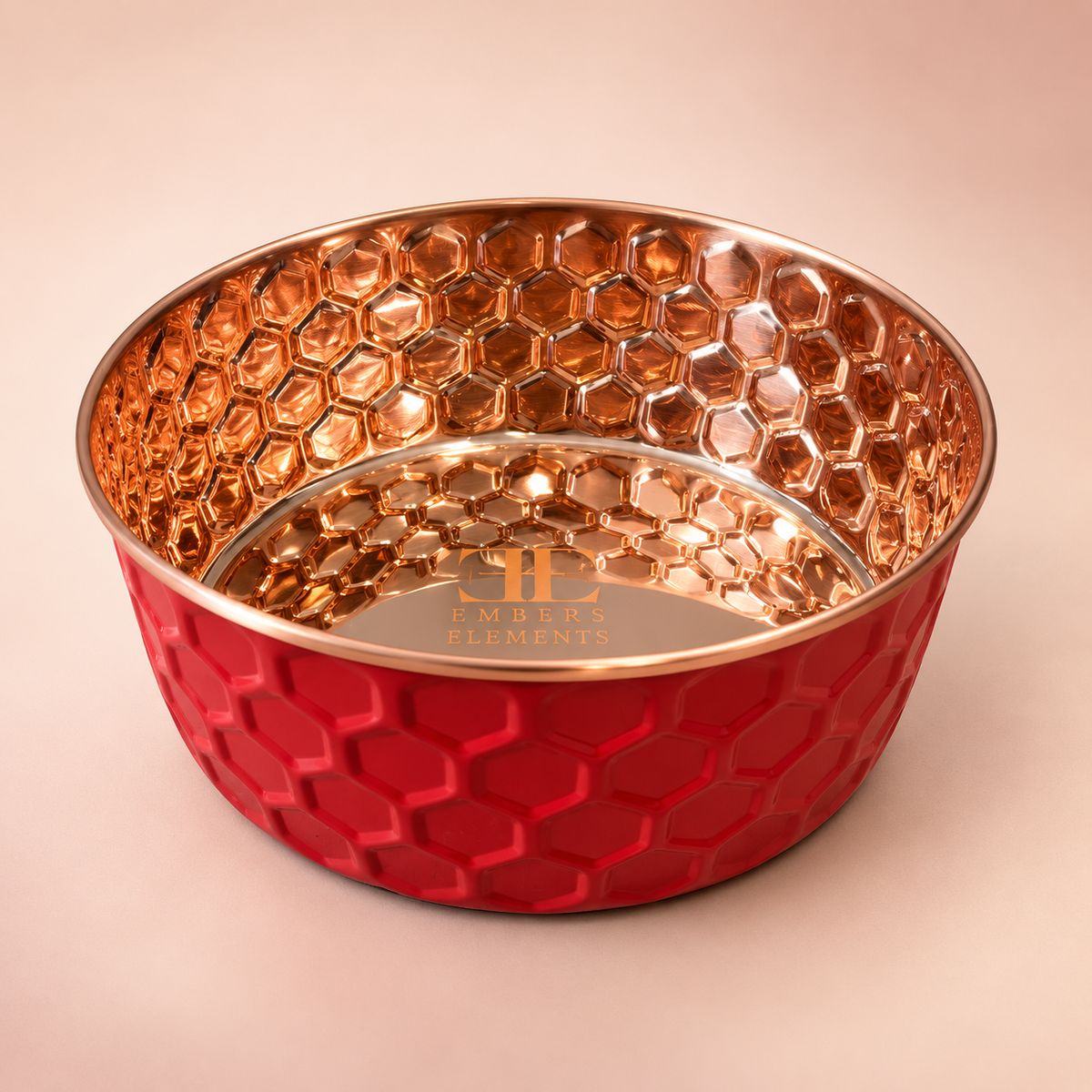 RUBY pink diamond-hammered copper pet bowl with the Embers Elements logo engraved inside, blush studio background