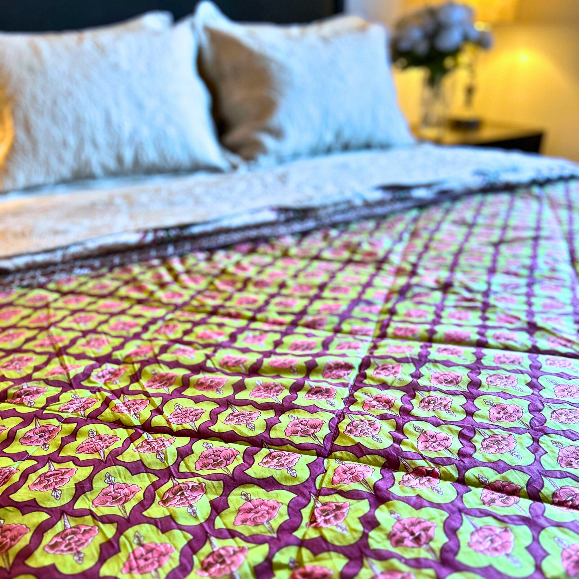 Vibrant floral Jaipuri cotton quilt, reversible.