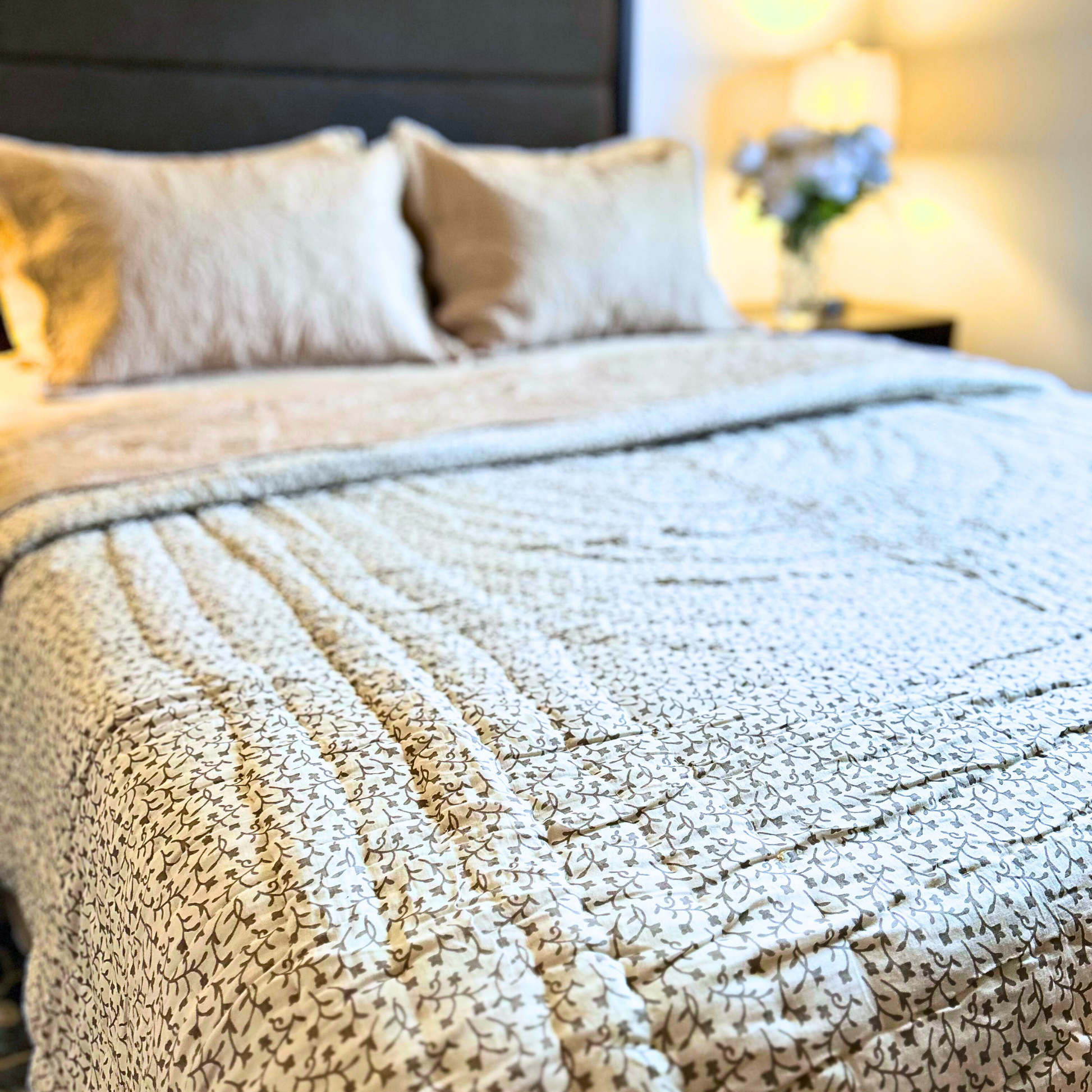 Cozy Jaipuri quilt with reversible orange and green patterns.