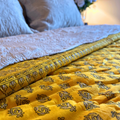 Lightweight reversible quilt with colorful Jaipuri floral design.